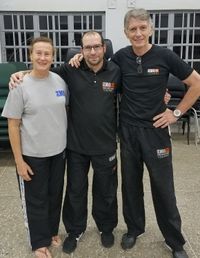 Nick Masi from the KMG Global Team (centre) with Rob and Ylona Engel